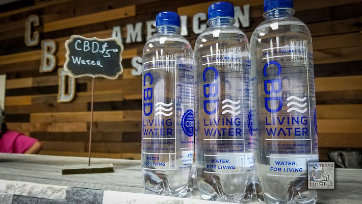 CBD water on shelf with plastic bottle