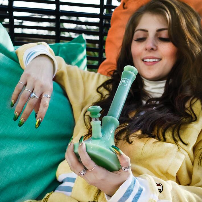 Woman holding a bong