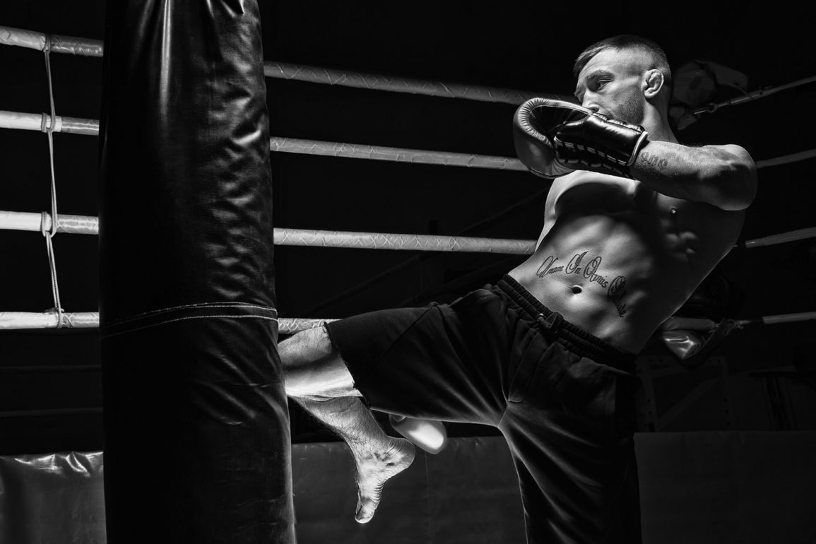 MMA fighter hitting punching bag training